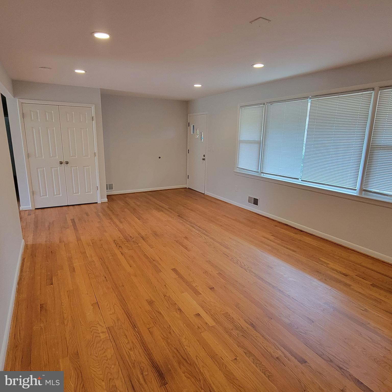 18320 Metz Drive Germantown, MD 20874 - Photo 6 of 31 a view of empty room with wooden floor