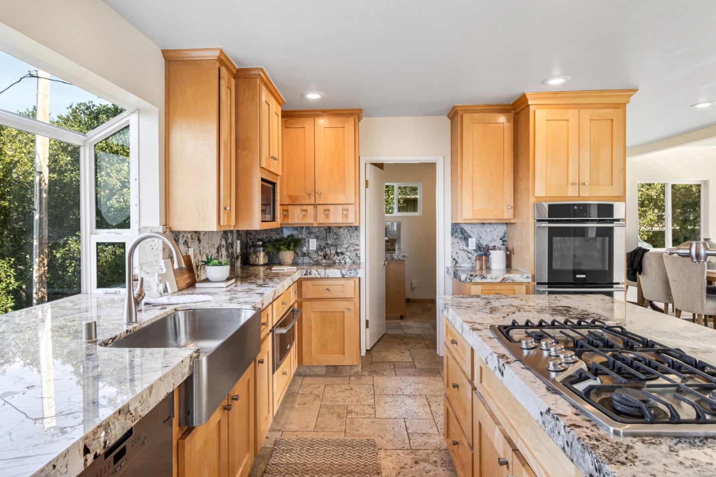 320 El Caminito Road Carmel Valley, CA 93924 - Photo 21 of 62 a kitchen with stainless steel appliances granite countertop a sink stove and refrigerator