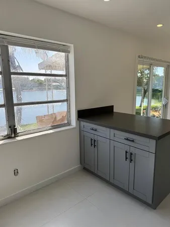 a kitchen with granite countertop cabinets and a sink