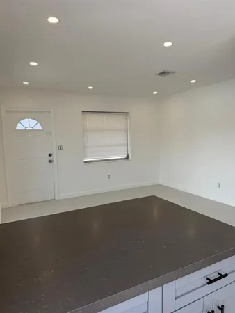 an empty room with a empty space and window