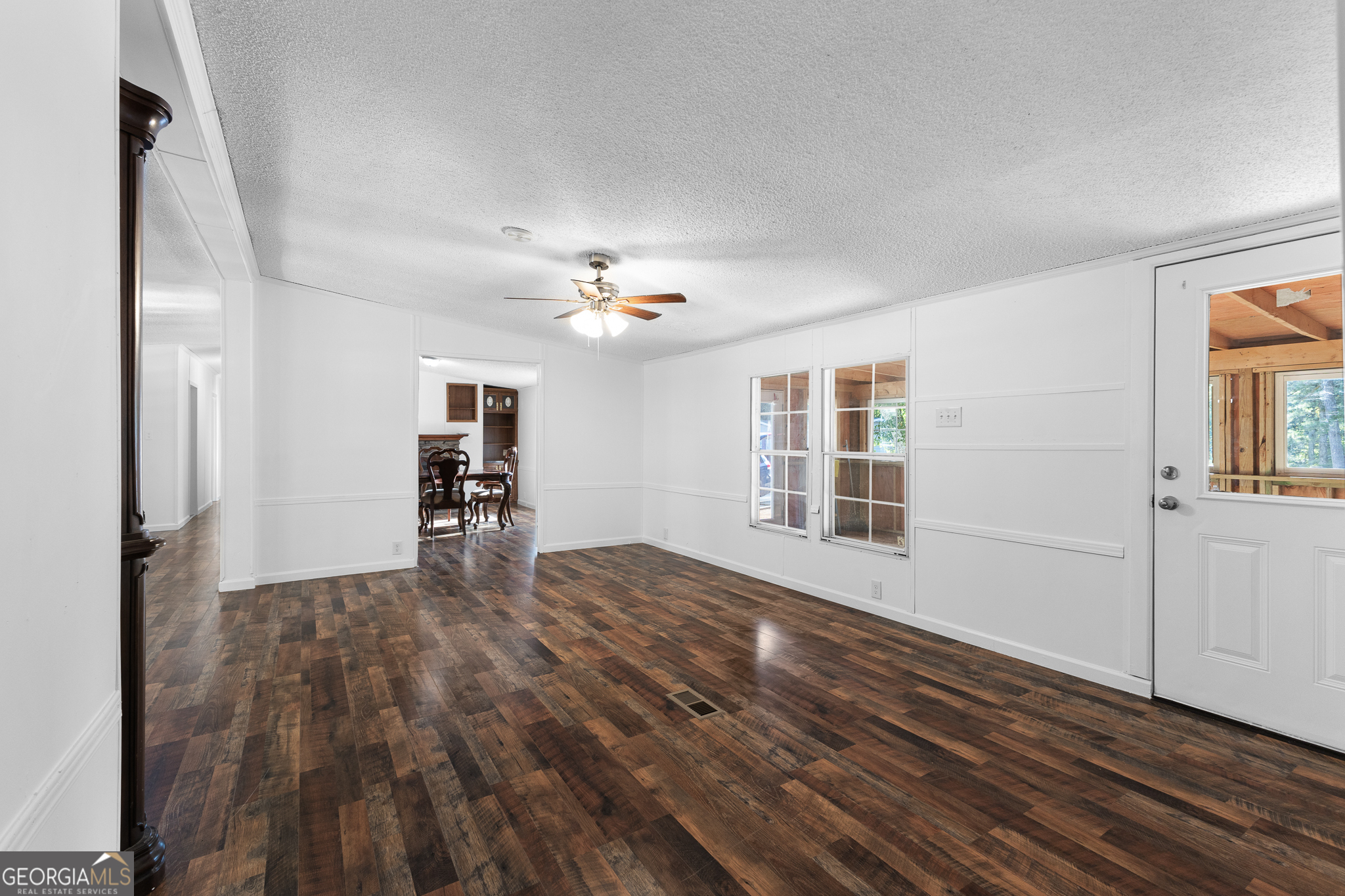4653 Whispering Pines, Unit 449 Buford, GA 30518 - Photo 28 of 33 a view of empty room with wooden floor