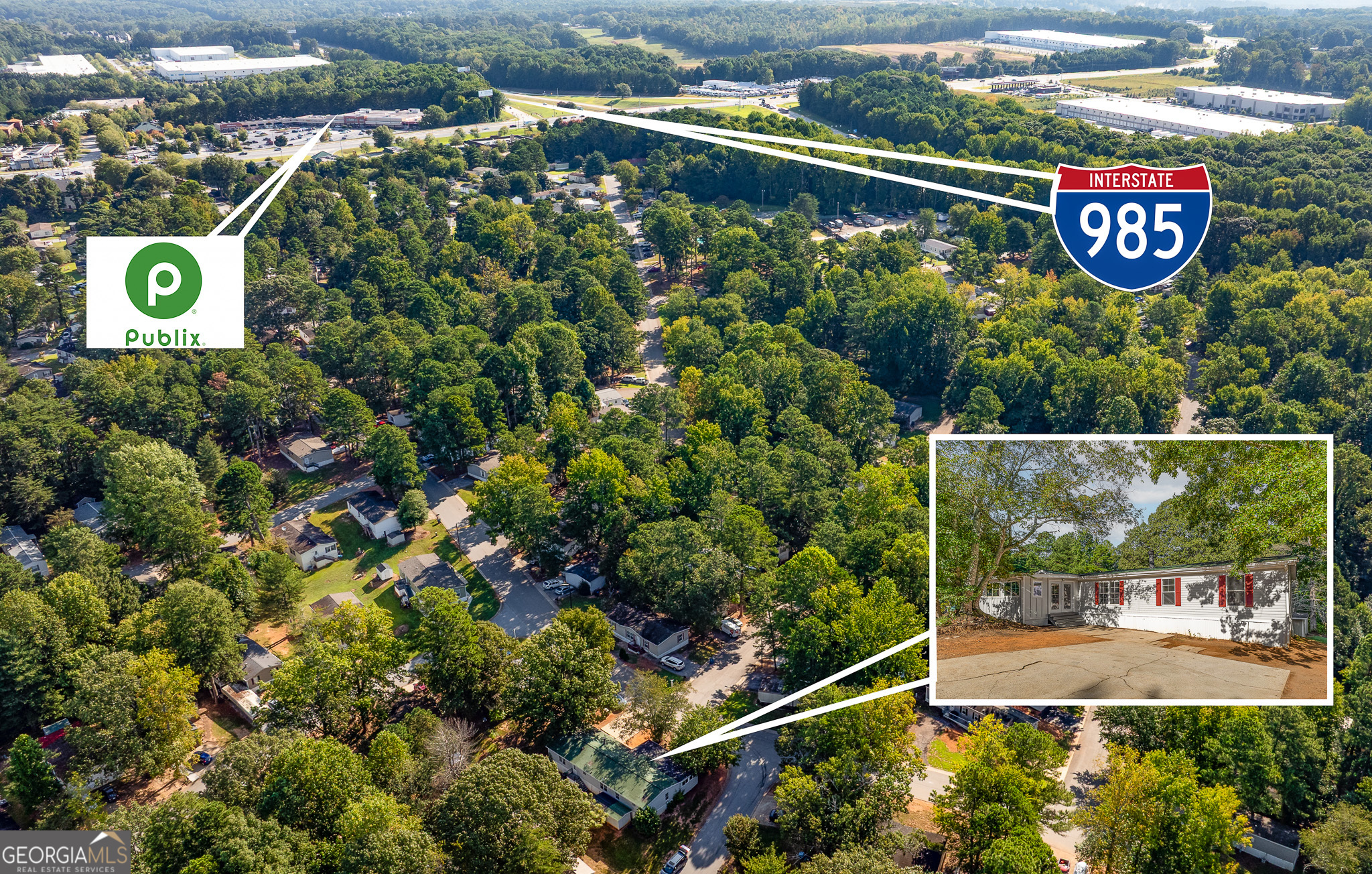 4653 Whispering Pines, Unit 449 Buford, GA 30518 - Photo 30 of 33 a view of a sign in a park next to a road