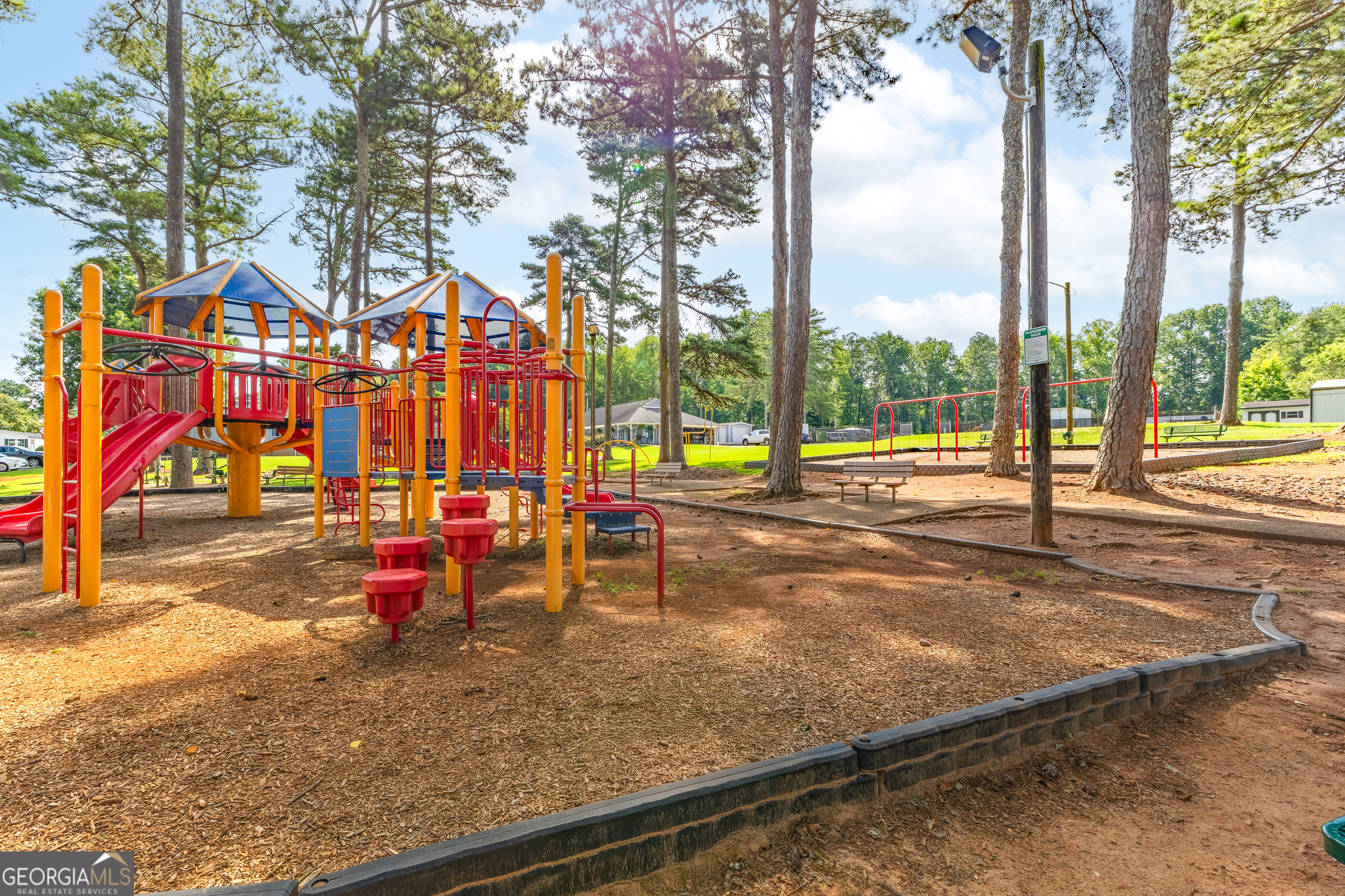 4653 Whispering Pines, Unit 449 Buford, GA 30518 - Photo 31 of 33 an outdoor space with seating