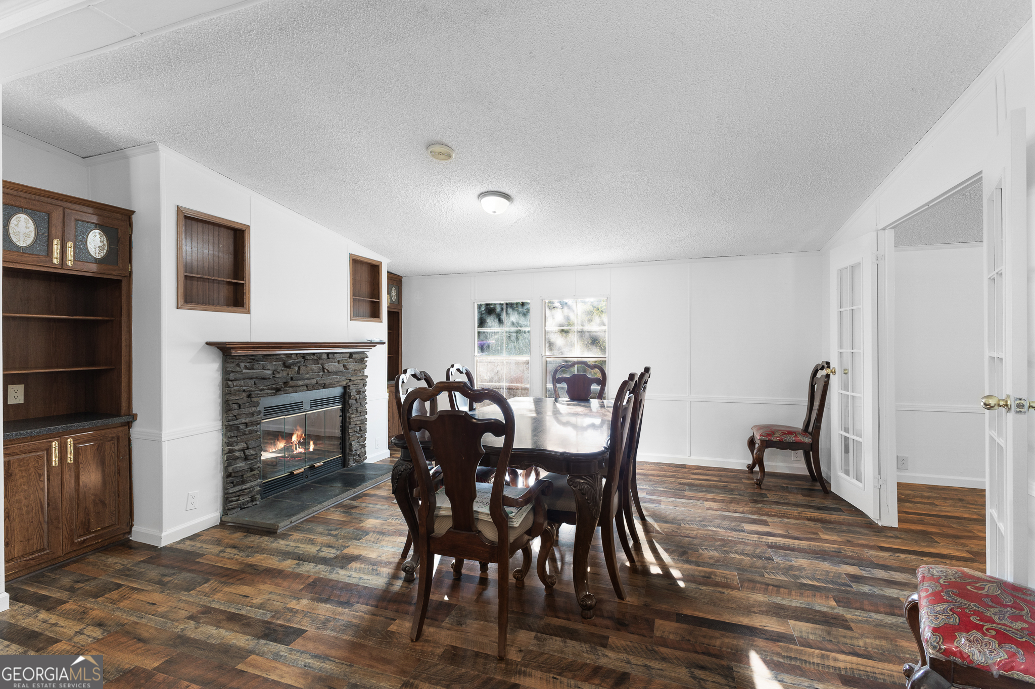 4653 Whispering Pines, Unit 449 Buford, GA 30518 - Photo 9 of 33 a view of a dining room with furniture window and wooden floor