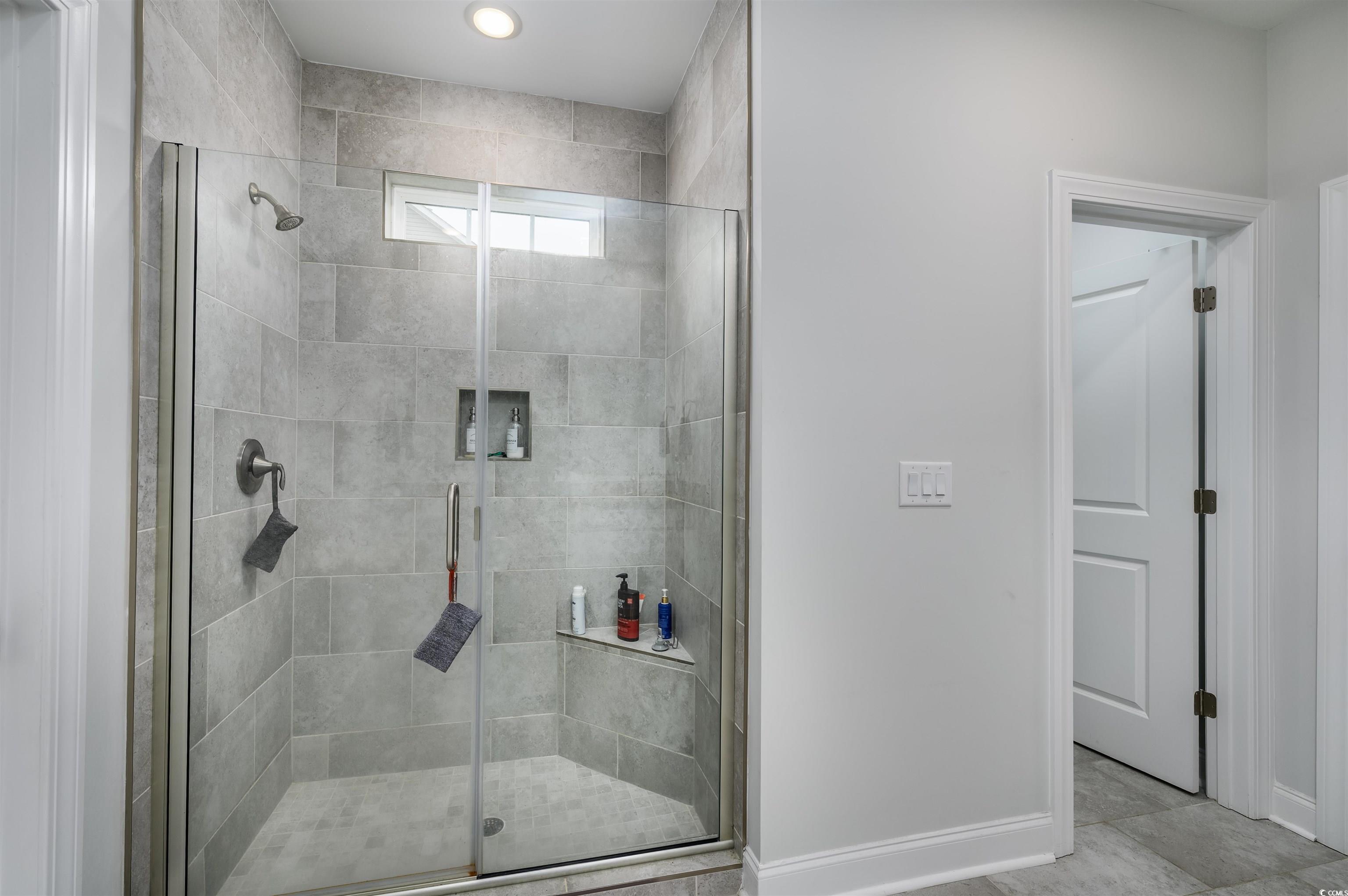 2550 Dogwood Road Longs, SC 29568 - Photo 18 of 35 Bathroom with a stall shower and tile patterned floors