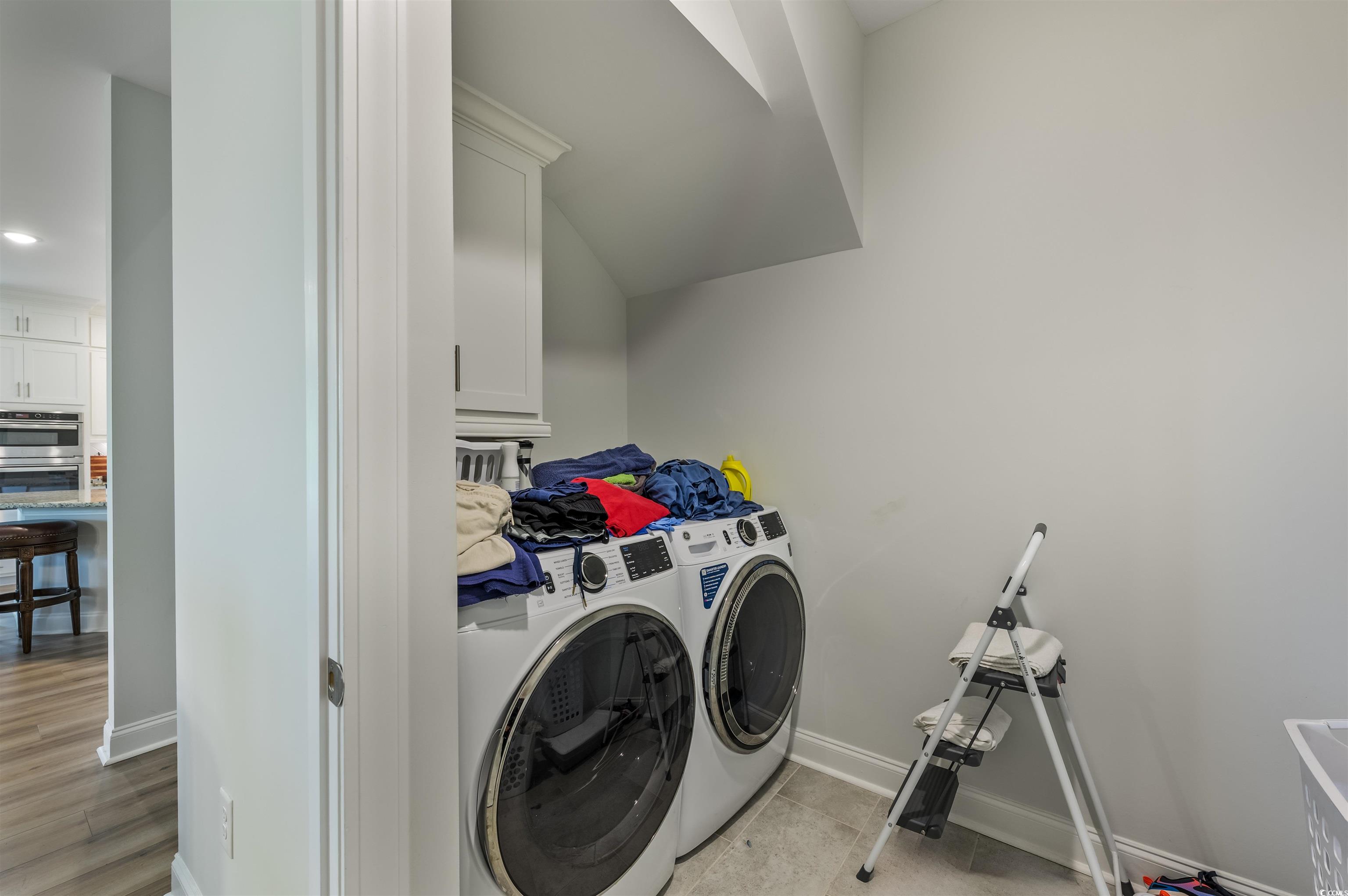 2550 Dogwood Road Longs, SC 29568 - Photo 20 of 35 Laundry area with washer and clothes dryer, cabinet space, and recessed lighting
