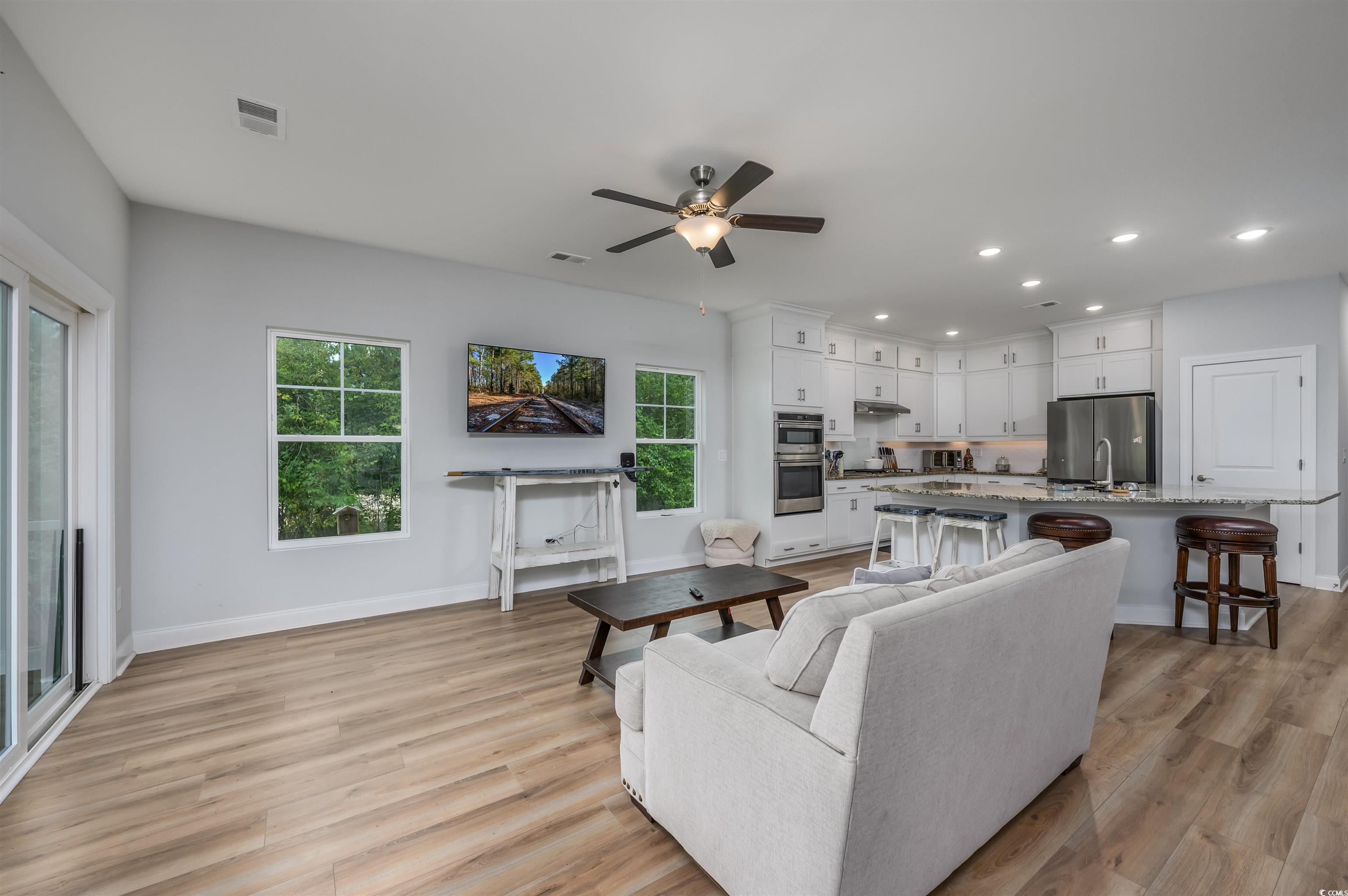 2550 Dogwood Road Longs, SC 29568 - Photo 2 of 35 Living area with light wood-type flooring, recessed lighting, and ceiling fan