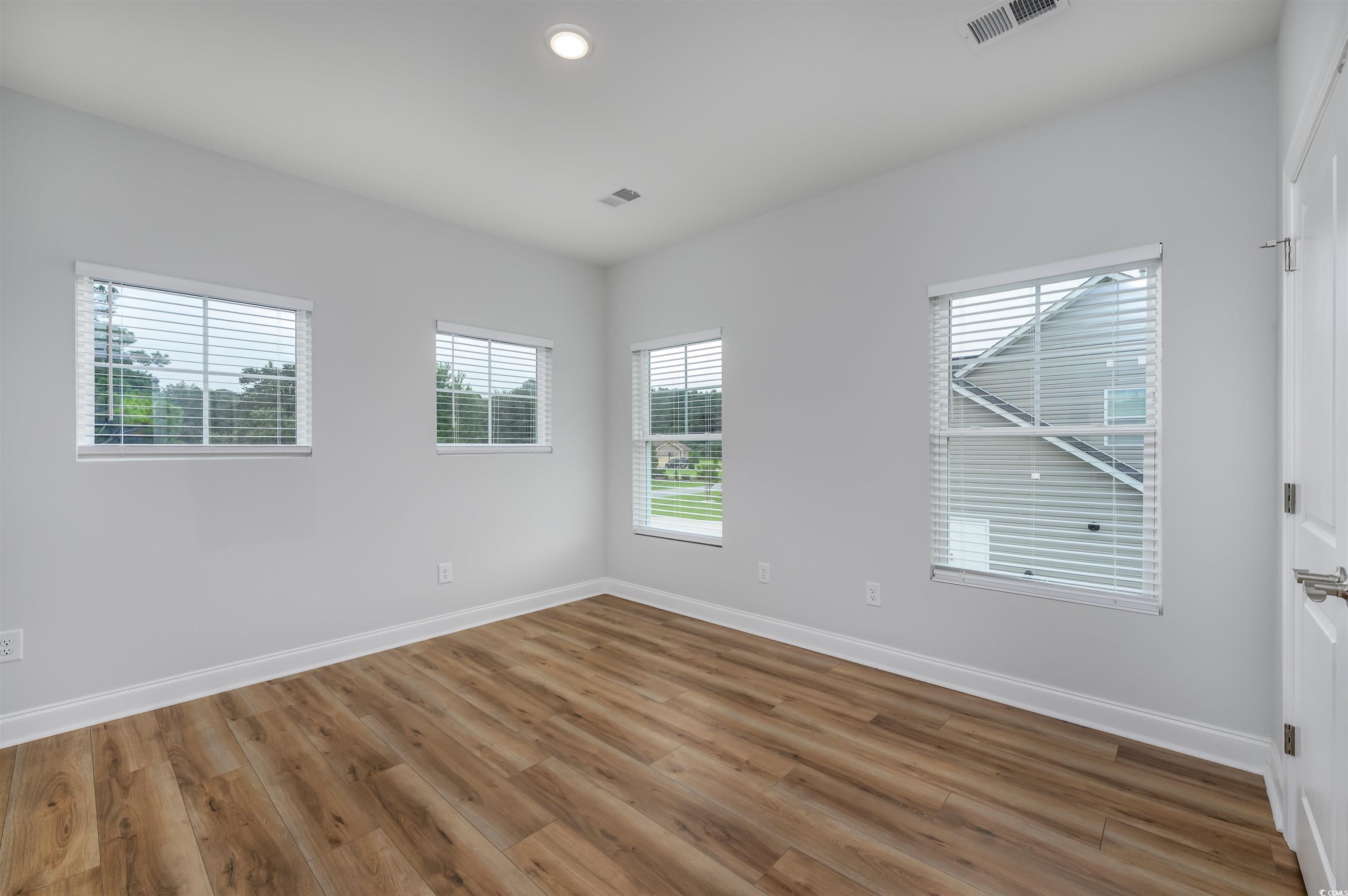 2550 Dogwood Road Longs, SC 29568 - Photo 21 of 35 Spare room featuring wood finished floors and recessed lighting