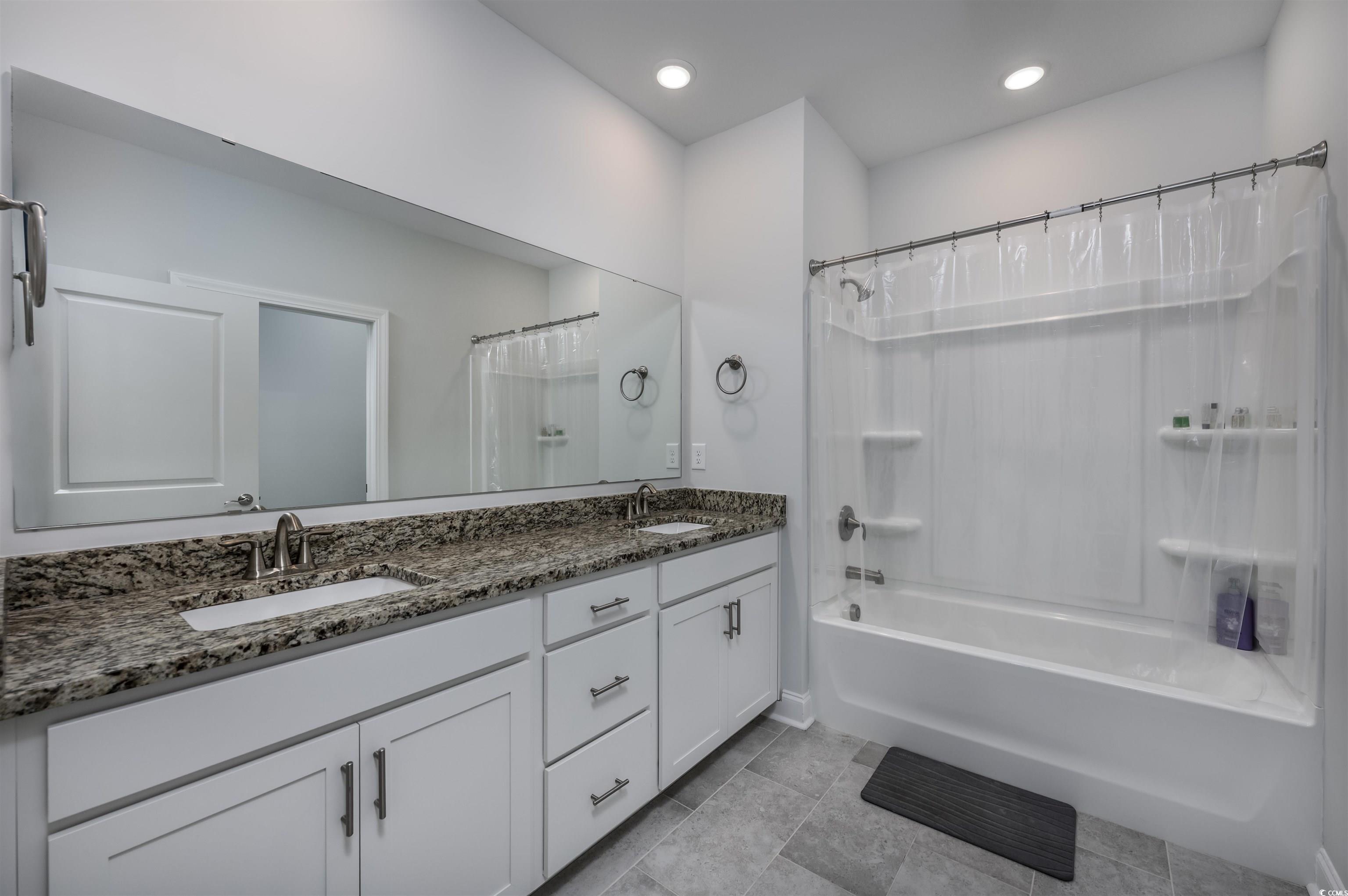 2550 Dogwood Road Longs, SC 29568 - Photo 24 of 35 Bathroom featuring shower / tub combo, double vanity, light tile patterned flooring, and recessed lighting