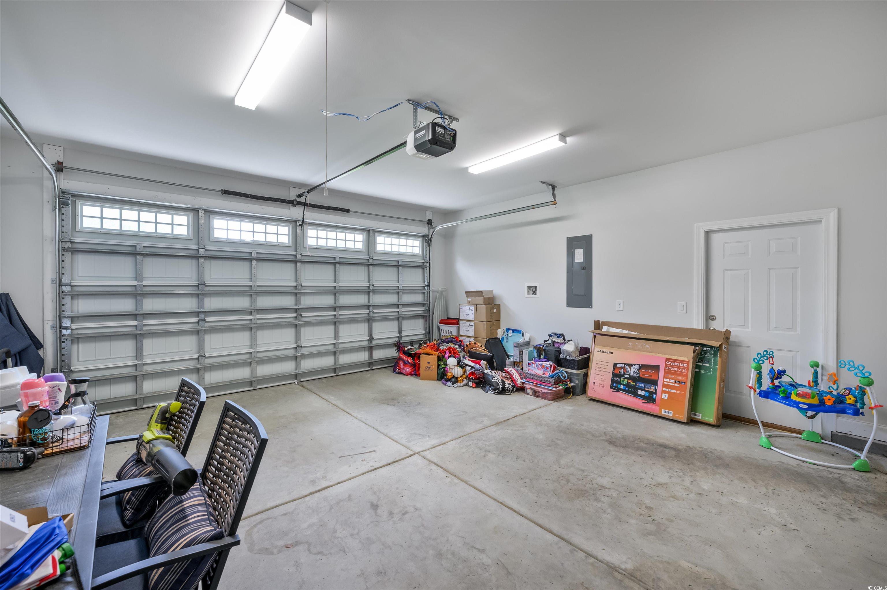 2550 Dogwood Road Longs, SC 29568 - Photo 27 of 35 Garage with electric panel and a garage door opener
