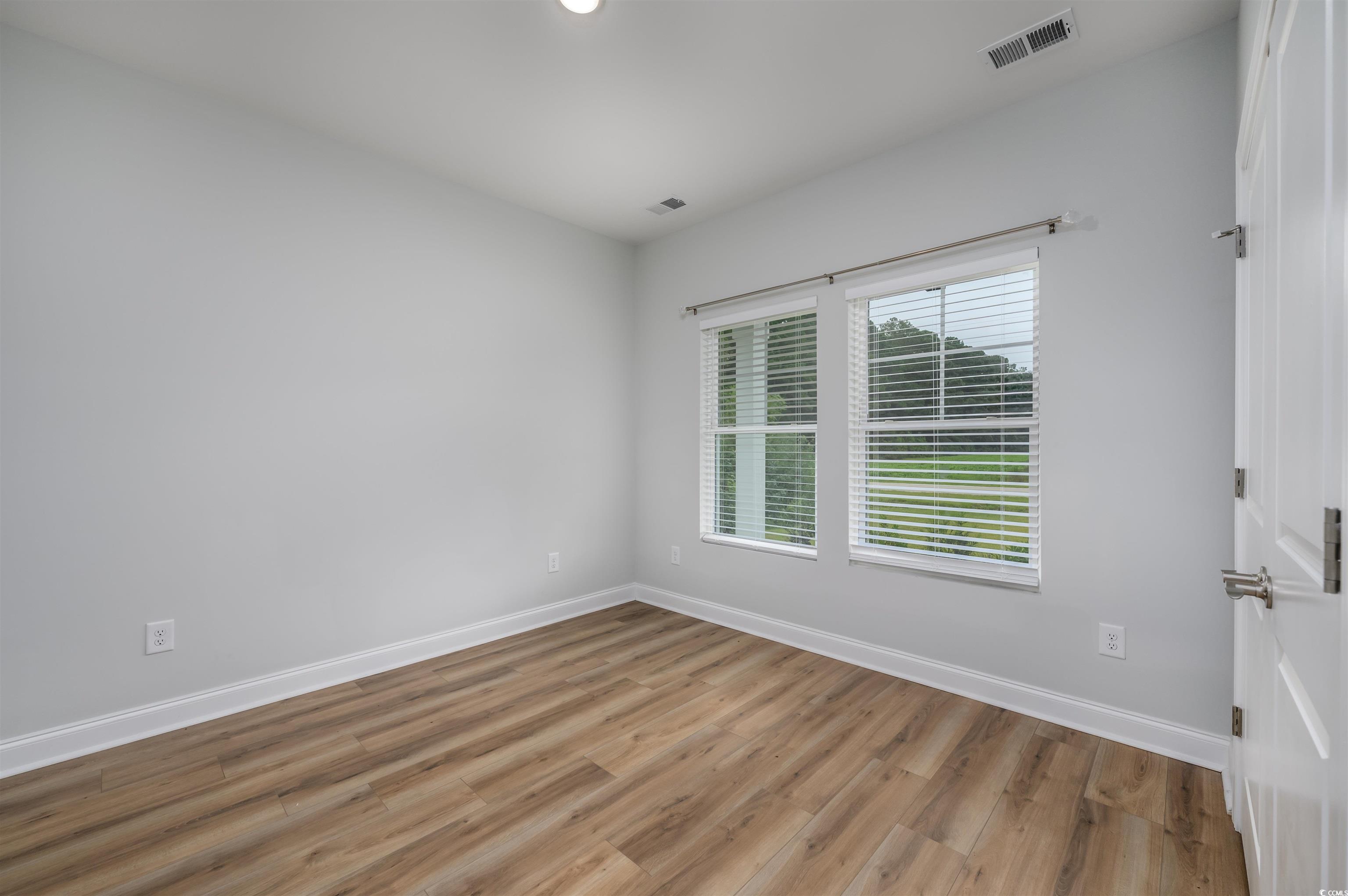 2550 Dogwood Road Longs, SC 29568 - Photo 9 of 35 Empty room featuring light wood-style flooring and recessed lighting