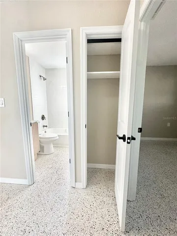 a view of an empty room with a window