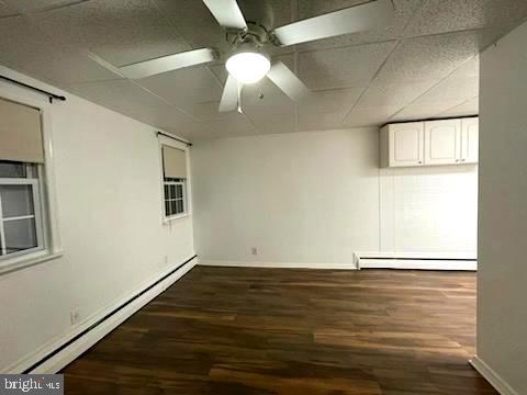 506 Rancocas Avenue Hainesport, NJ 08036 - Photo 4 of 22 an empty room with wooden floor fan and windows