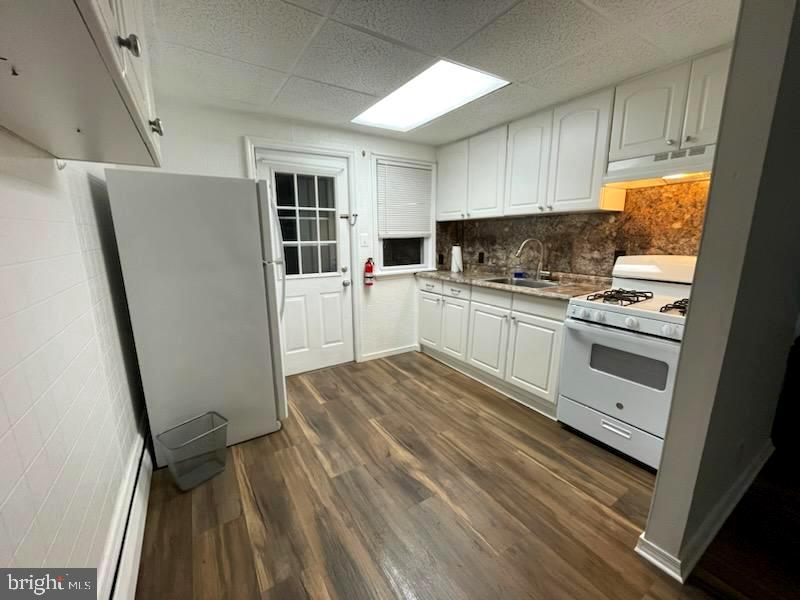 506 Rancocas Avenue Hainesport, NJ 08036 - Photo 5 of 22 a kitchen with white cabinets and white appliances