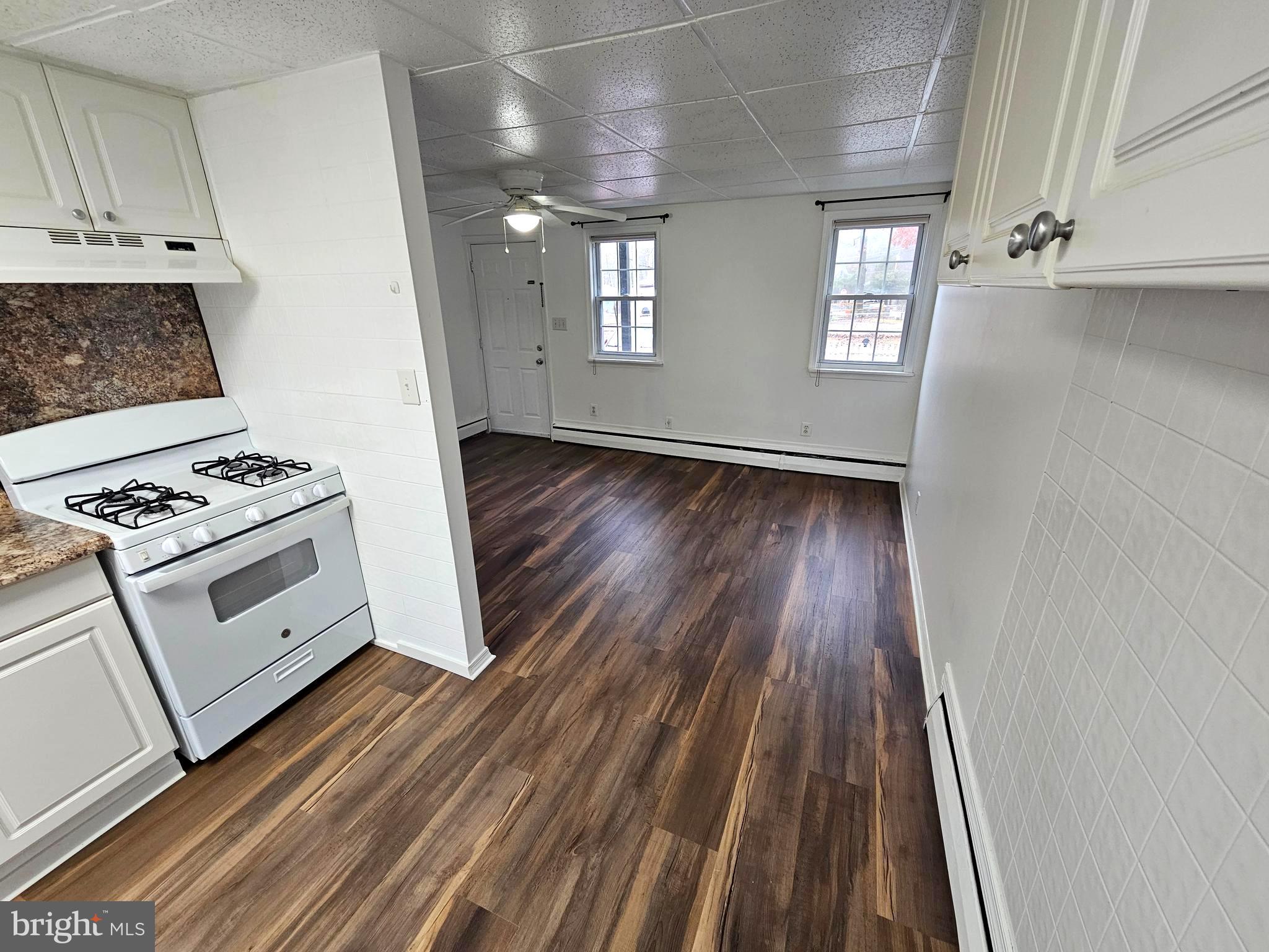 506 Rancocas Avenue Hainesport, NJ 08036 - Photo 7 of 22 a view of kitchen and entryway with wooden floor
