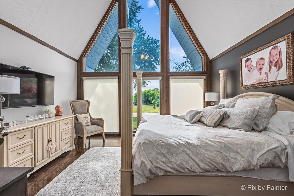 2628 Knob Hill Road Johnsburg, IL 60051 - Photo 27 of 43 a bedroom with a bed and a large window with the outer view