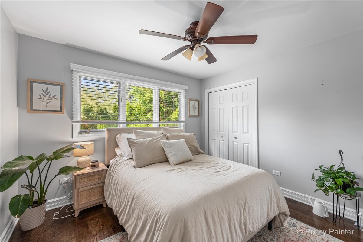 2628 Knob Hill Road Johnsburg, IL 60051 - Photo 29 of 43 a bedroom with a bed and a potted plant