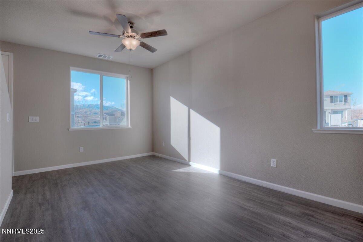 1168 Arrastra Road, Unit LOT 18 Reno, NV 89512 - Photo 5 of 24 wooden floor in an empty room with a window