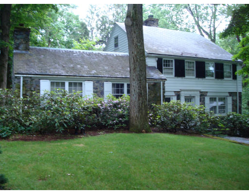 105 Country Club Road Newton, MA 02459 - Photo 1 of 16 a front view of a house with a yard