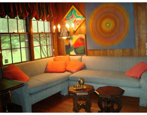 105 Country Club Road Newton, MA 02459 - Photo 10 of 16 a living room with a couch and chandelier