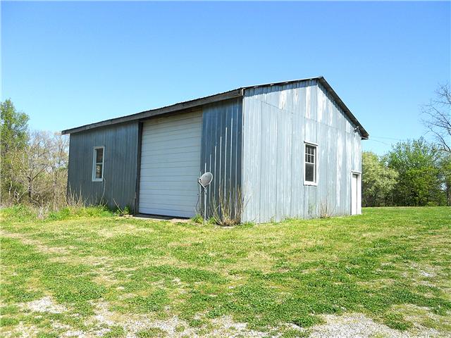 10515 Moss Branch Road Bon Aqua, TN 37025 - Photo 15 of 20 This very sturdy shop/garage measures 40 x 30 and has a concrete floor, power & tall doors for housing an RV or camper.