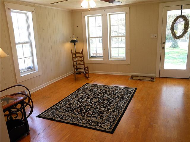 10515 Moss Branch Road Bon Aqua, TN 37025 - Photo 6 of 20 Homey living room has wood floors & lots of natural light.