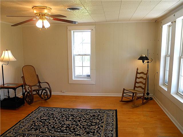 10515 Moss Branch Road Bon Aqua, TN 37025 - Photo 7 of 20 Another living room view- ceiling fan & HVAC vent.