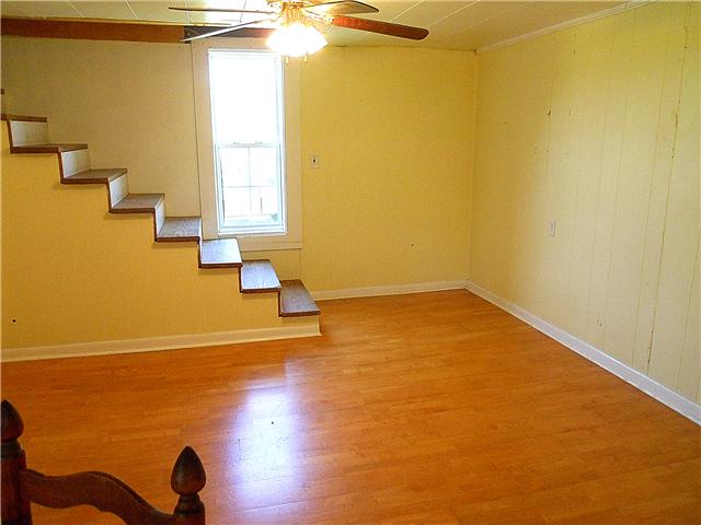 10515 Moss Branch Road Bon Aqua, TN 37025 - Photo 10 of 20 Dining room has a ceiling fan & wood floors.
