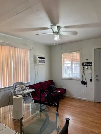 a living room with furniture and a window