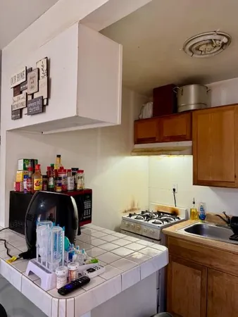 a kitchen with a stove and cabinets