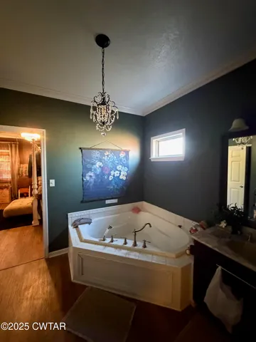 a bath tub sitting in a bathroom next to a window