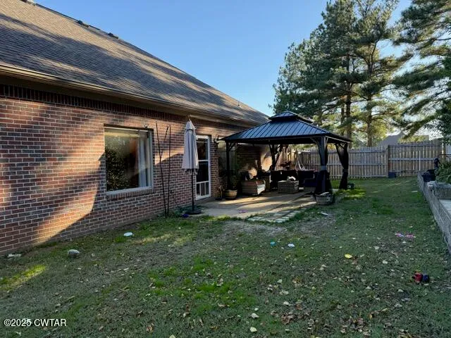 a backyard of a house with lots of green space