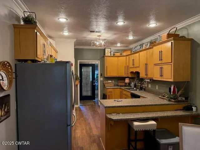 a kitchen with a sink appliances and cabinets