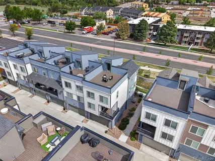 an aerial view of a building with parking