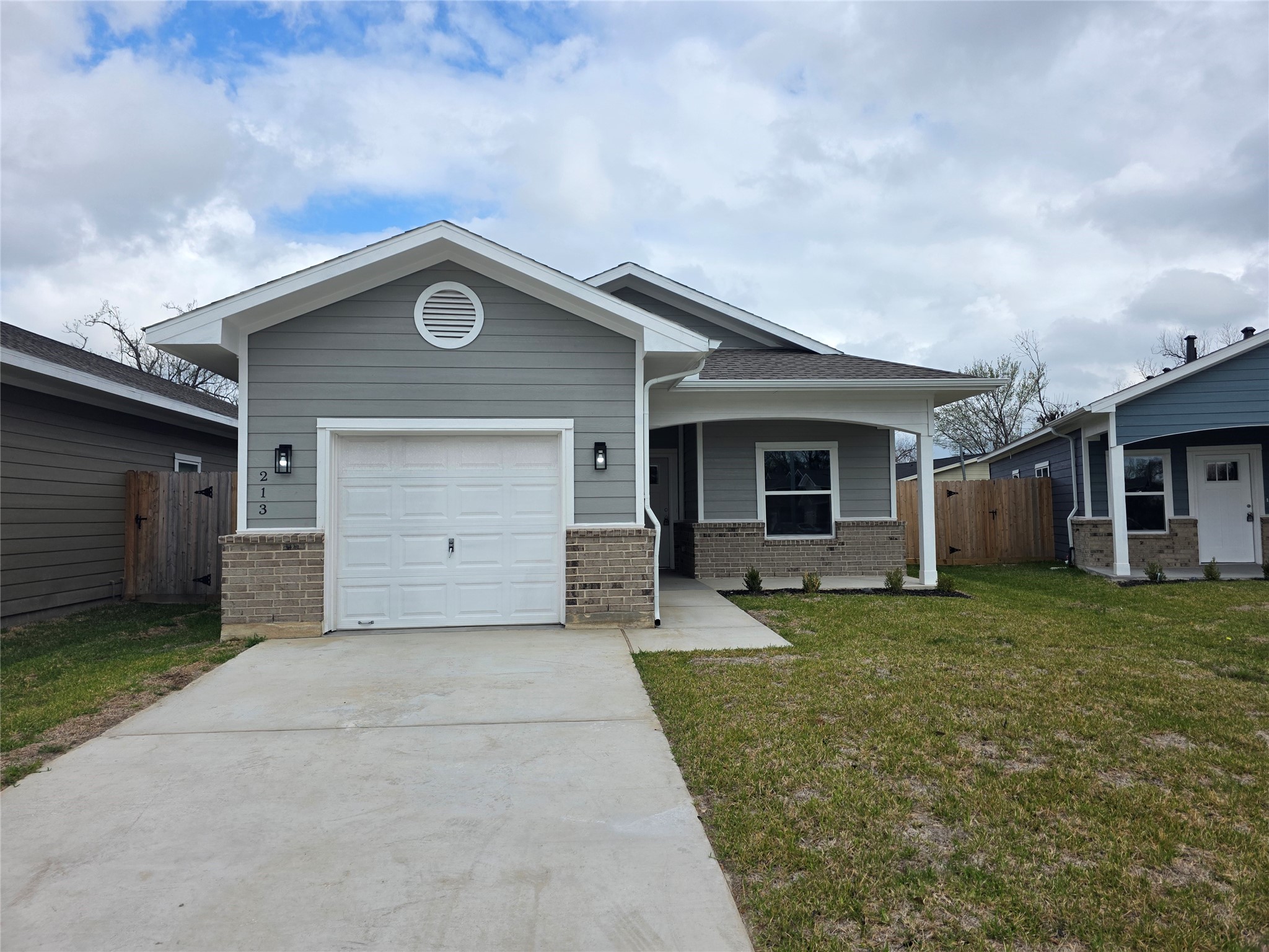 213 Dipping Stream Street Houston, TX 77076 - Photo 1 of 10 front view of a house with a yard