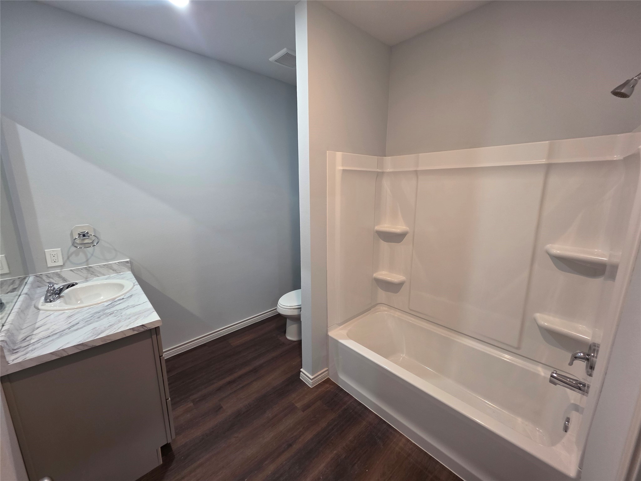 213 Dipping Stream Street Houston, TX 77076 - Photo 8 of 10 a bathroom with a sink a toilet and shower