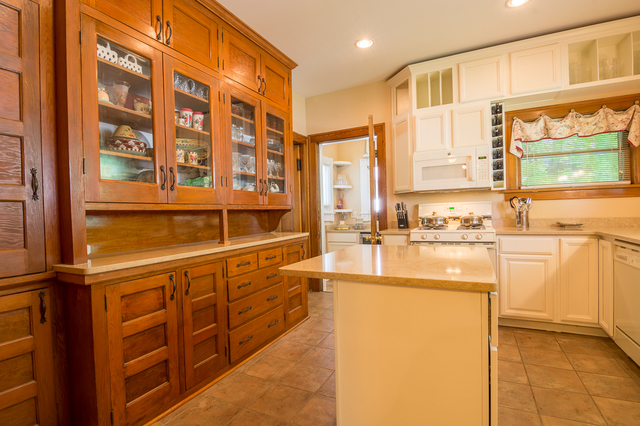 800 North Spring Street Elgin, IL 60120 - Photo 8 of 20 a large kitchen with stainless steel appliances a sink and cabinets