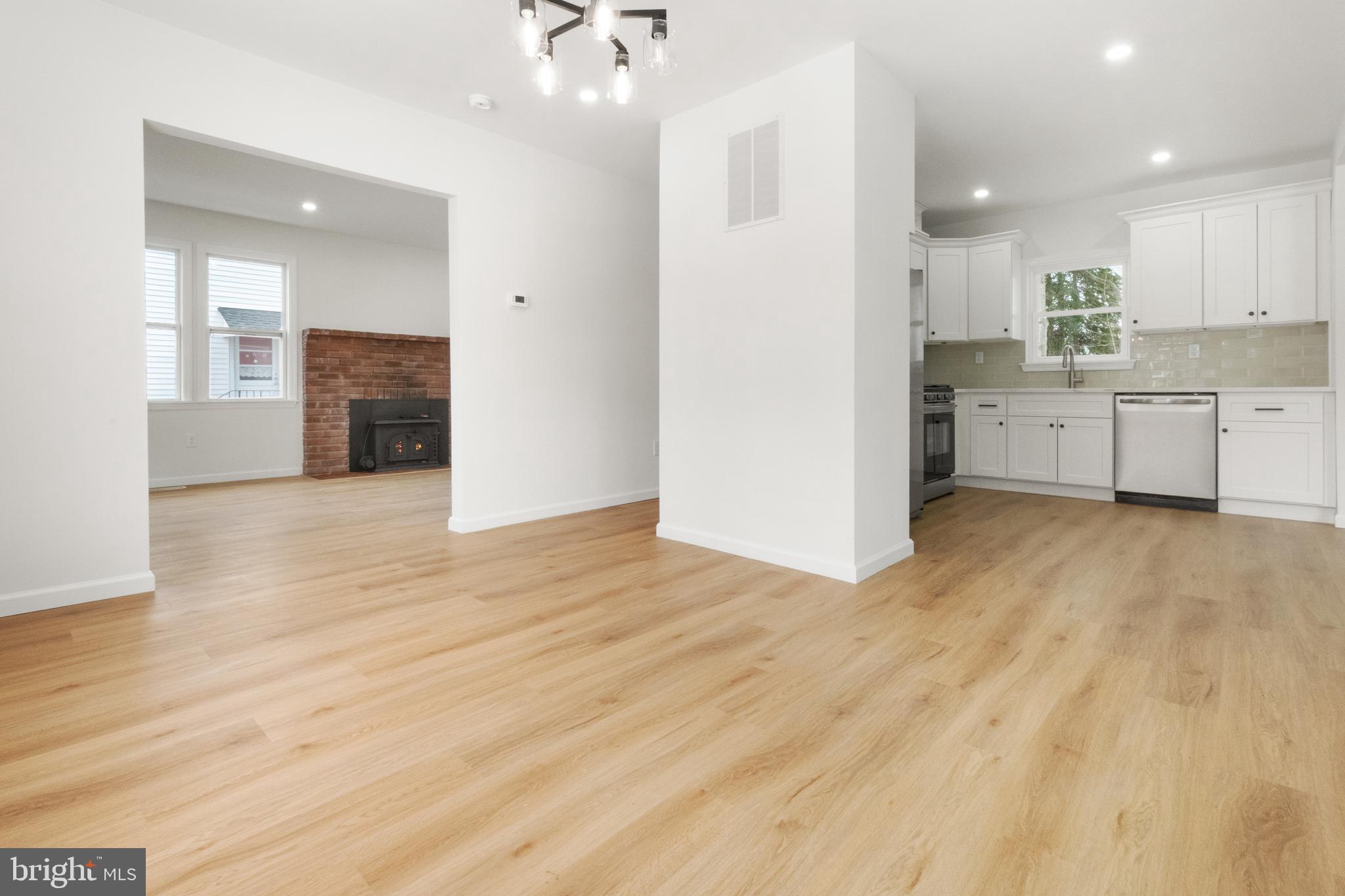 119 Hemlock Avenue Laurel Springs, NJ 08021 - Photo 1 of 23 a view of a kitchen with wooden floor and a sink