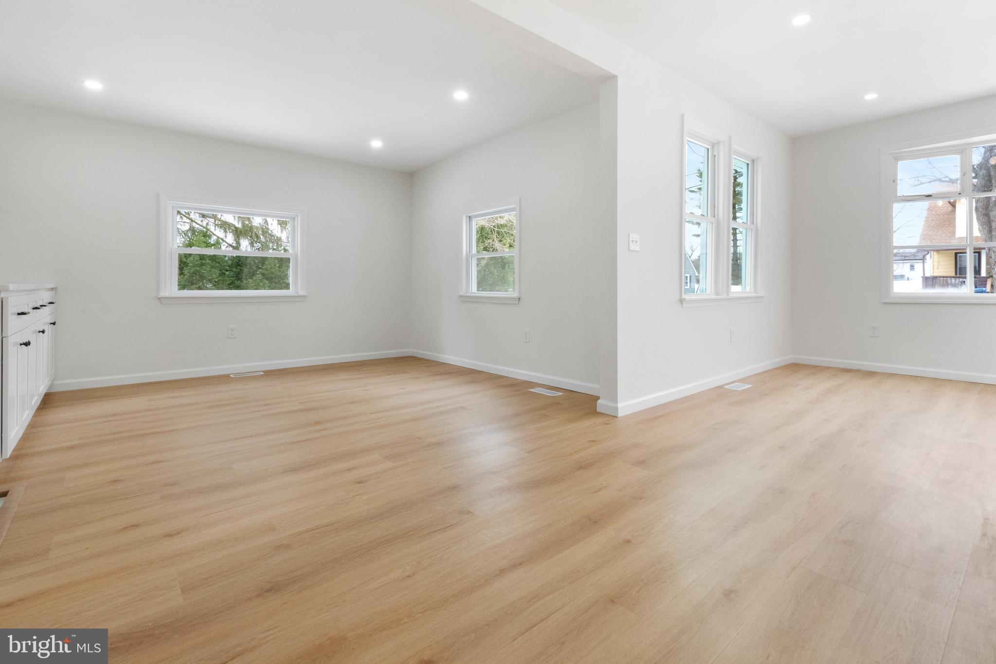 119 Hemlock Avenue Laurel Springs, NJ 08021 - Photo 13 of 23 an empty room with wooden floor and windows