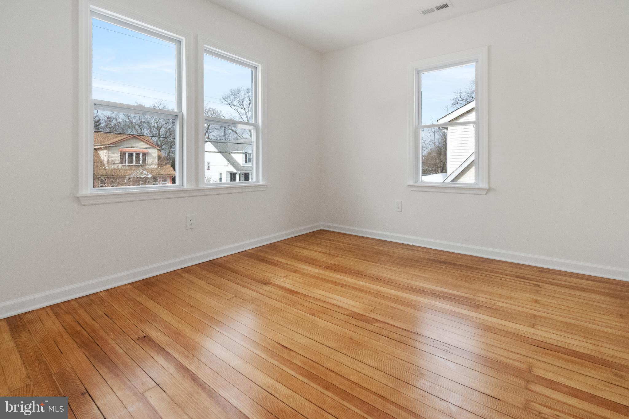 119 Hemlock Avenue Laurel Springs, NJ 08021 - Photo 19 of 23 a view of empty room with wooden floor and fan