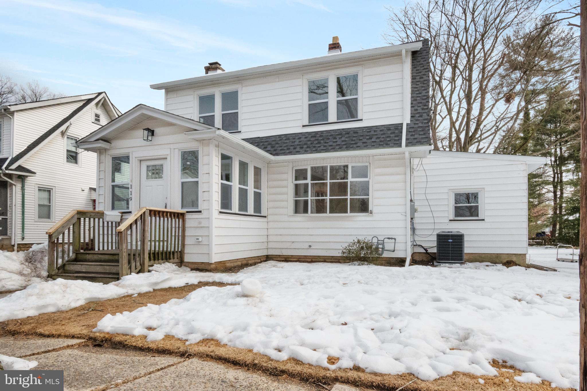119 Hemlock Avenue Laurel Springs, NJ 08021 - Photo 2 of 23 a front view of a house with a yard covered in snow