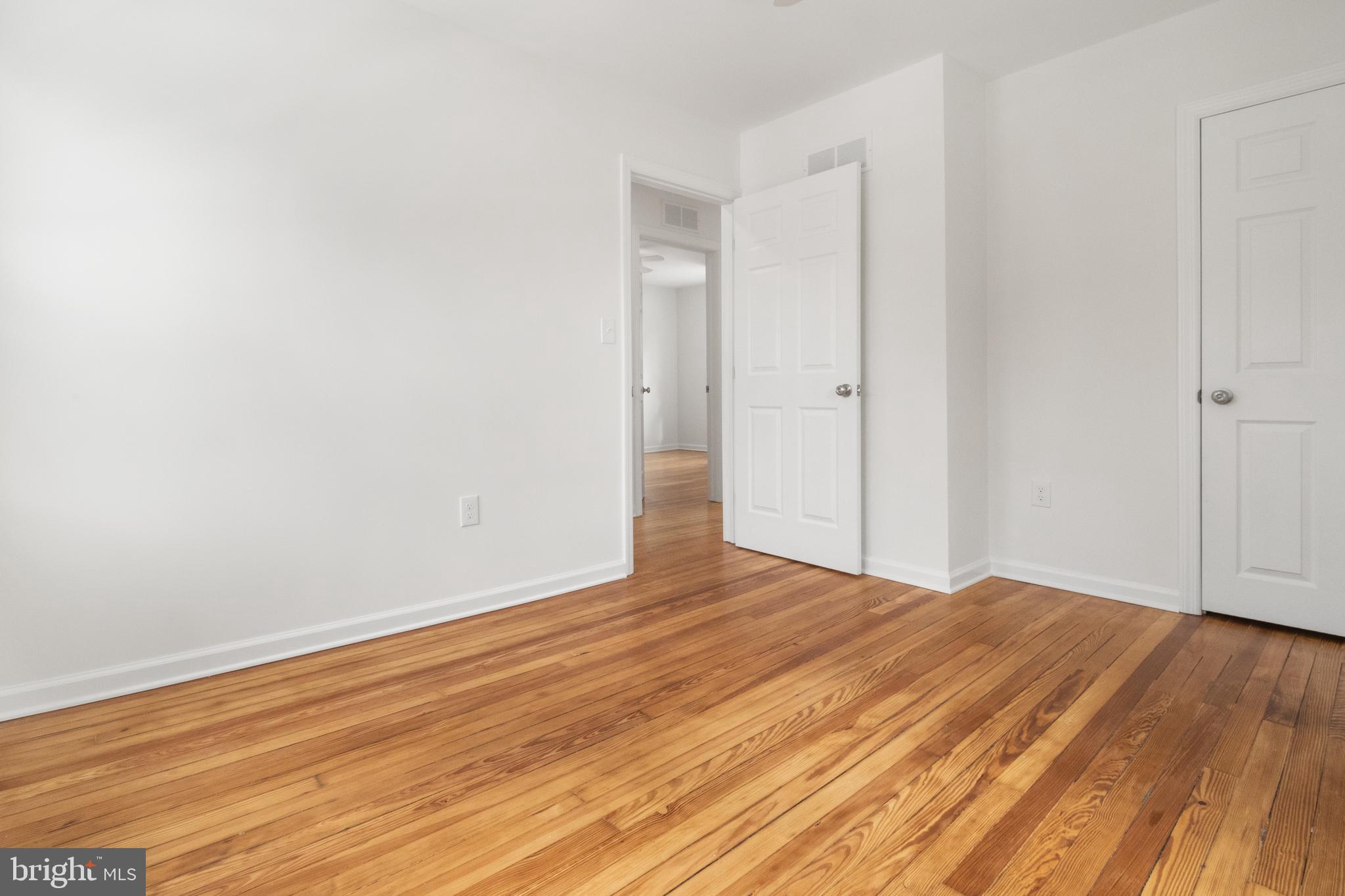 119 Hemlock Avenue Laurel Springs, NJ 08021 - Photo 23 of 23 a view of an empty room with wooden floor