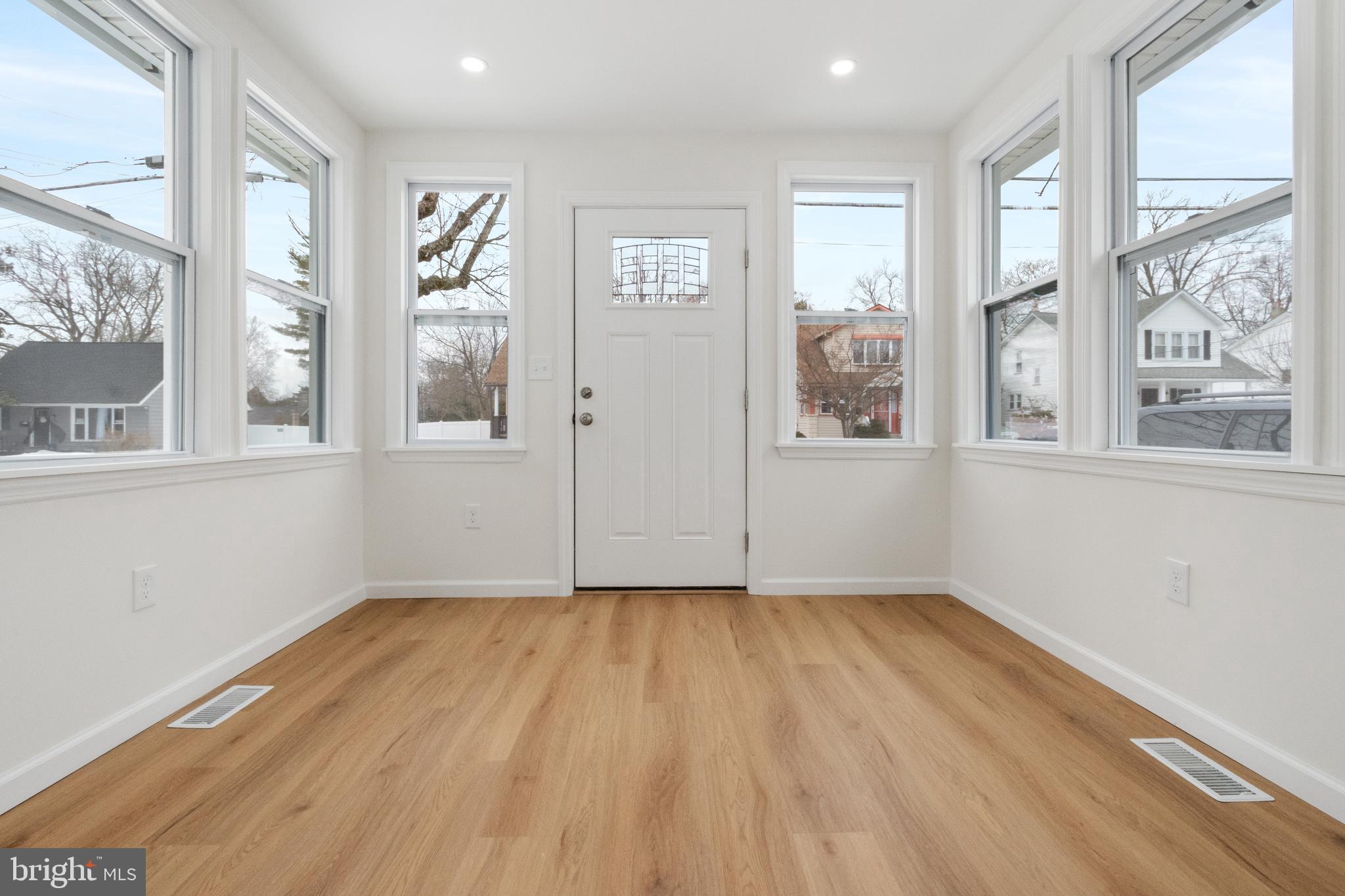 119 Hemlock Avenue Laurel Springs, NJ 08021 - Photo 4 of 23 wooden floor in an empty room with a window