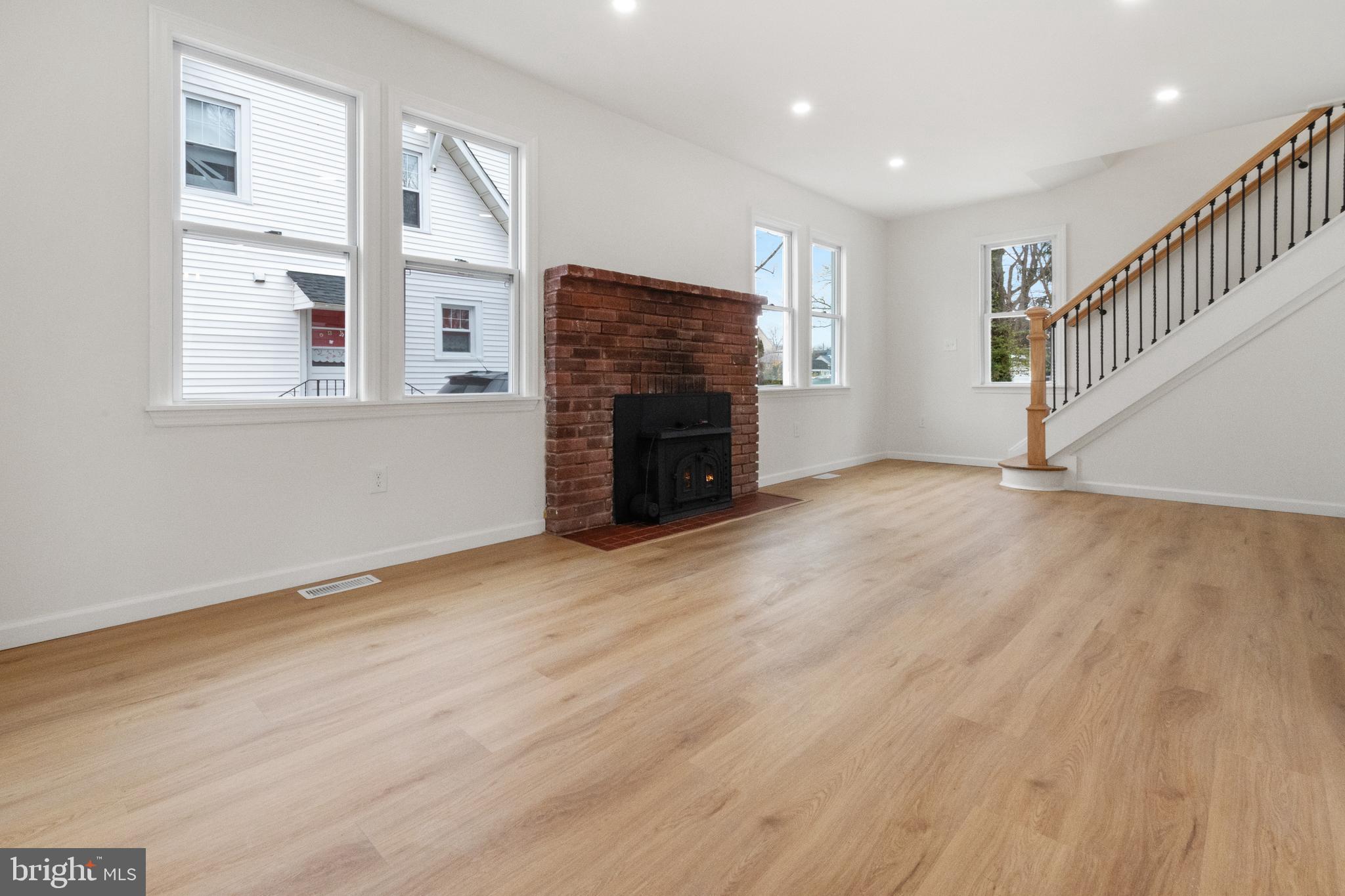 119 Hemlock Avenue Laurel Springs, NJ 08021 - Photo 6 of 23 a view of an empty room with wooden floor and a window