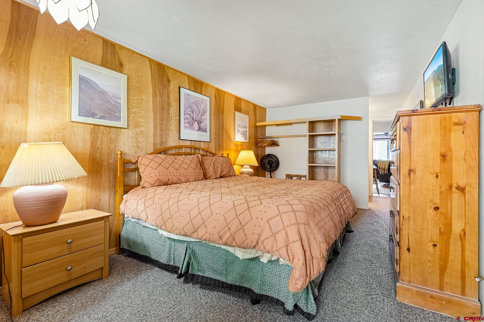 400 Sheol Street, Unit 7 Durango, CO 81301 - Photo 17 of 35 a spacious bedroom with a bed and a window