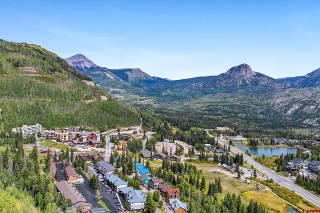 a view of a city with mountains in the background