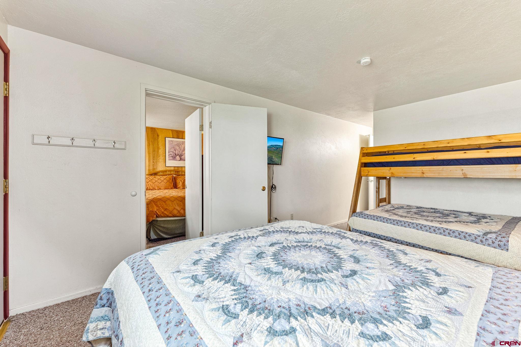 400 Sheol Street, Unit 7 Durango, CO 81301 - Photo 22 of 35 a bedroom with a bed and a window