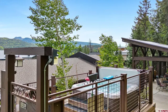 a view of roof deck with furniture
