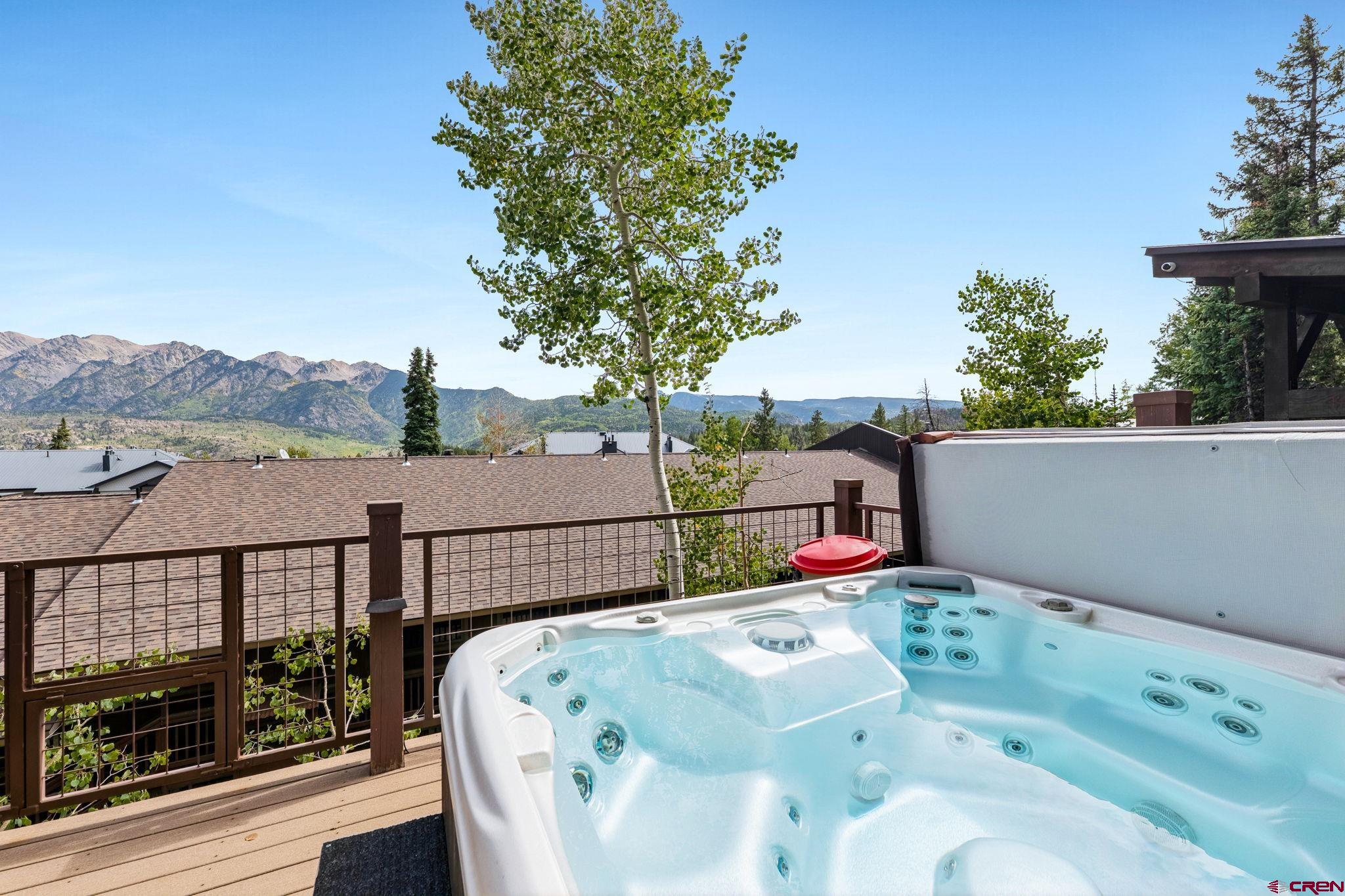 400 Sheol Street, Unit 7 Durango, CO 81301 - Photo 32 of 35 a balcony with flower plants and wooden fence