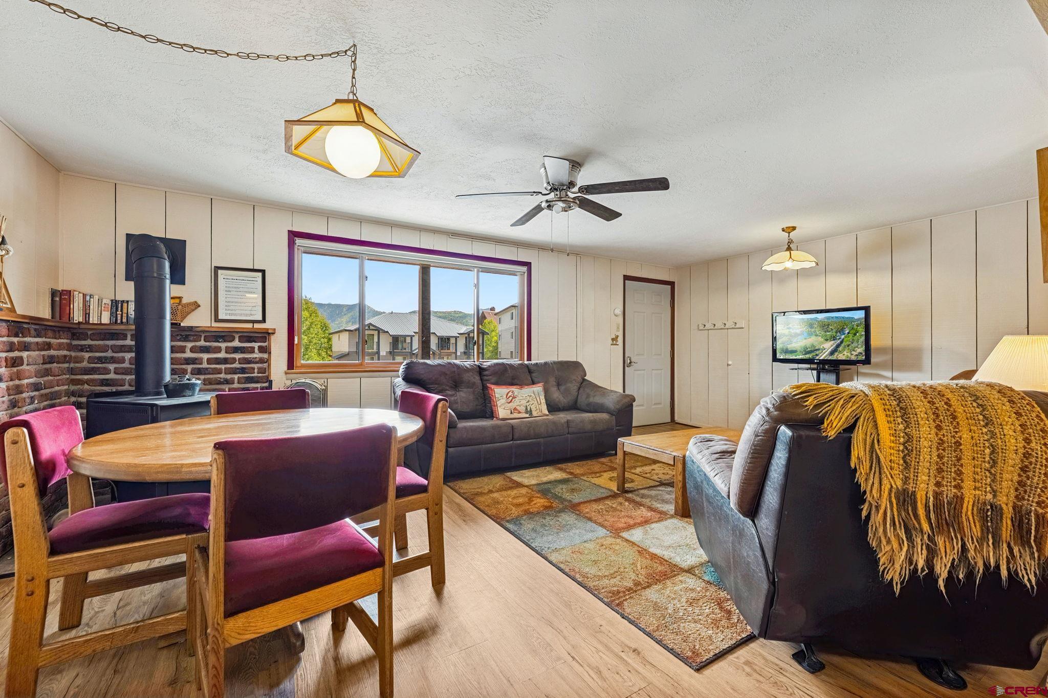 400 Sheol Street, Unit 7 Durango, CO 81301 - Photo 9 of 35 a living room with furniture kitchen view and a large window